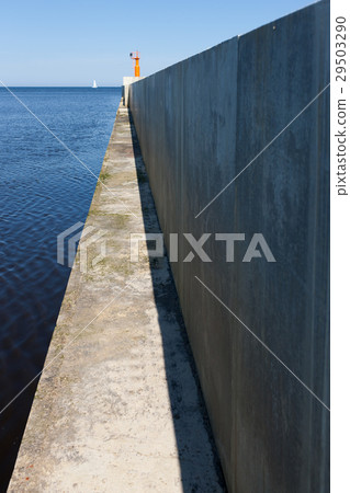 Concrete cape in the sea with white sail Concrete cape in the sea with white sail 29503290