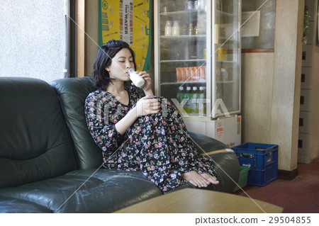 Women relaxing while drinking milk Sento Women relaxing while drinking milk Sento 29504855