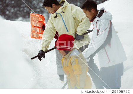 Snow shovel family living in the snow country 29506732