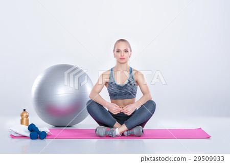 beautiful blonde girl in sportswear does exercises beautiful blonde girl in sportswear does exercises 29509933