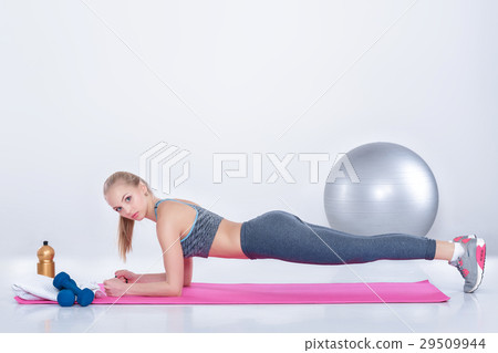 beautiful blonde girl in sportswear does exercises beautiful blonde girl in sportswear does exercises 29509944
