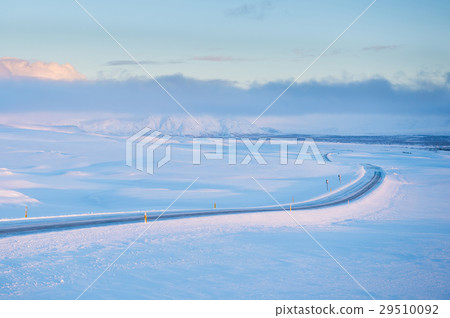 Snowy long road in Iceland 29510092