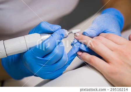 Closeup shot of a woman in a nail salon receiving 29510214
