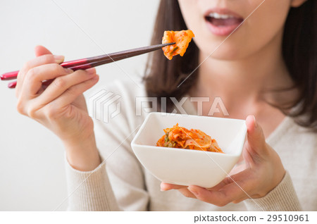 Female hand to eat kimchi Female hand to eat kimchi 29510961
