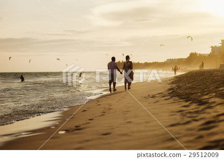 happy couple run on beach 29512009