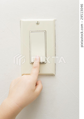 Child's hand switching the switch 29513046