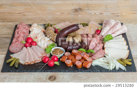 Sausage plate variation on a wooden table 29513280