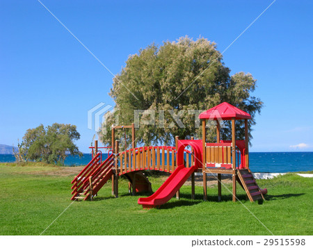 Playground on green grass by sea 29515598