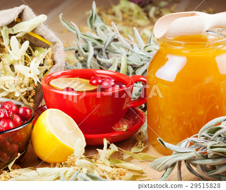 cranberries, jar with honey and fruit tea cup 29515828