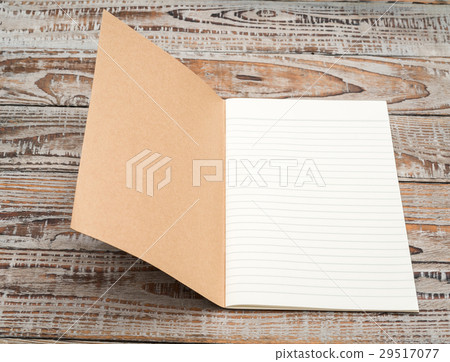 Recycled paper book on wood background . Recycled paper book on wood background . 29517077