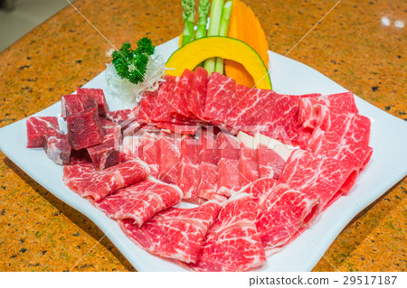 Uncooked raw fresh beef . Uncooked raw fresh beef . 29517187
