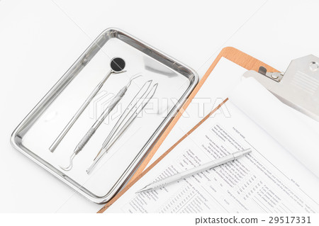 Dental tools, equipment and dental chart on white background Dental tools, equipment and dental chart on white background 29517331