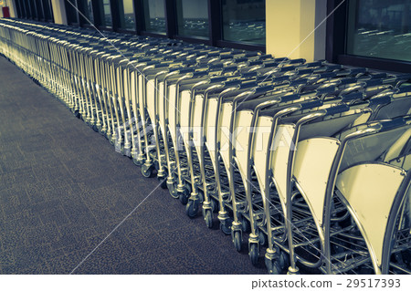 luggage carts at airport terminal . ( Filtered image processed vintage effect. ) 29517393
