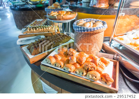 Assortment of fresh pastry on table in buffet . Assortment of fresh pastry on table in buffet . 29517452