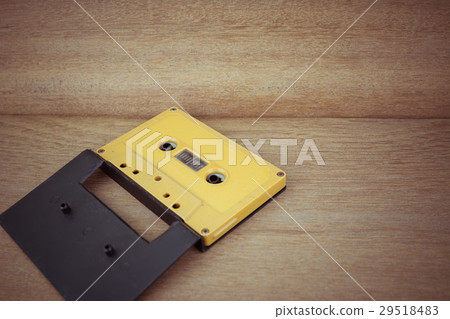 old cassette tape with case on wooden background old cassette tape with case on wooden background 29518483