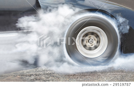 Drag racing car burns rubber off tires for race Drag racing car burns rubber off tires for race 29519787