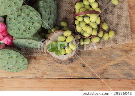 Lotus seeds in nature on wood background 29526048
