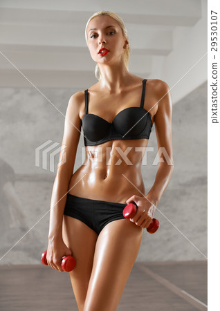 Slim, sexy,blonde, young sportswoman with athletic 29530107