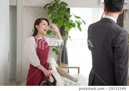 Housewife looking after her husband going to work 29533349