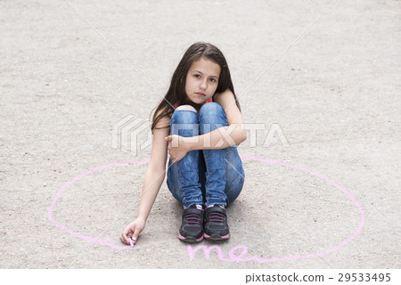 Sad girl sitting on the ground in a circle Sad girl sitting on the ground in a circle 29533495