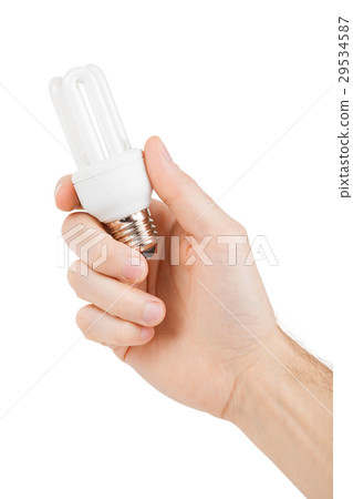 Hand holding energy saving fluorescent light bulb Hand holding energy saving fluorescent light bulb 29534587