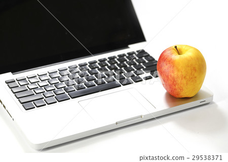 Apple on laptop isolated on white backbground Apple on laptop isolated on white backbground 29538371
