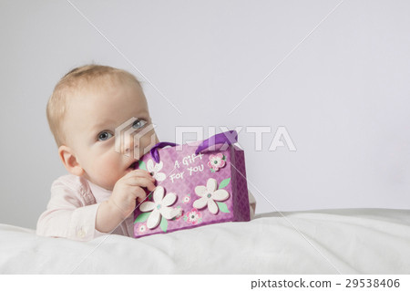 Mothers day. Adorable infant boy with a gift 29538406
