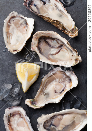 Oysters and lemon Oysters and lemon 29538863
