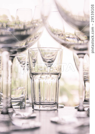 water glass on the shelves , Drinking water  29539108