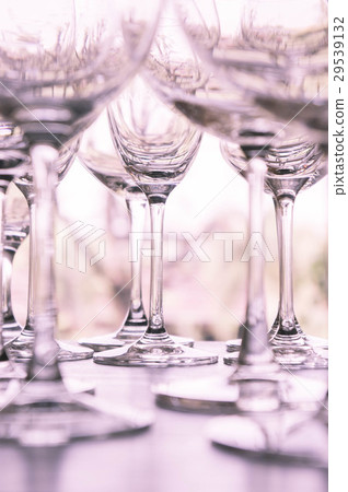 water glass on the shelves , Drinking water 29539132