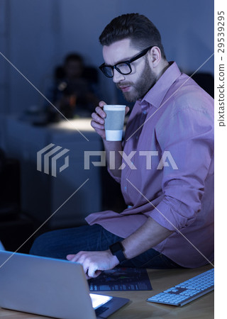 Handsome smart IT man pressing a button 29539295