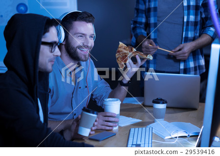 Happy joyful man enjoying his meal 29539416