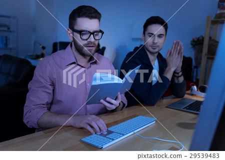 Good looking nice man holding a book 29539483