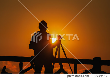 silhouette photographer with sunset silhouette photographer with sunset 29539487