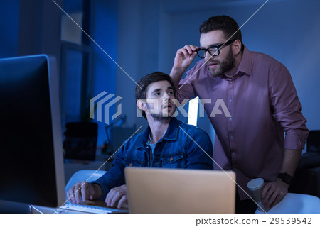 Smart bearded man fixing his glasses 29539542