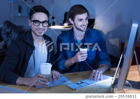 Cheerful genius hackers celebrating their success 29539831
