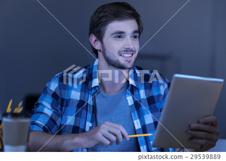 Cheerful nice man being happy about his work 29539889