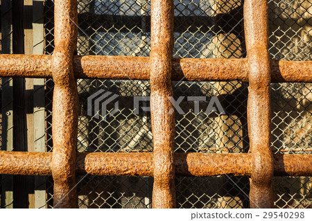 Close up iron bars or metal grating on window or Close up iron bars or metal grating on window or 29540298