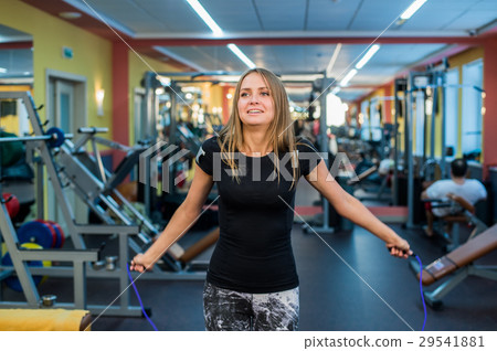 athletic young woman in sportswear exercising with athletic young woman in sportswear exercising with 29541881