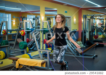 athletic young woman in sportswear exercising with 29541882