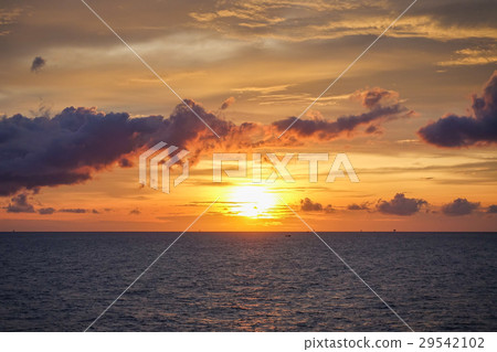 Sunset at sea with beautiful clouds in evening Sunset at sea with beautiful clouds in evening 29542102