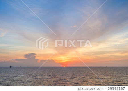 Sun set at sea with blue sky and clouds. Sun set at sea with blue sky and clouds. 29542167
