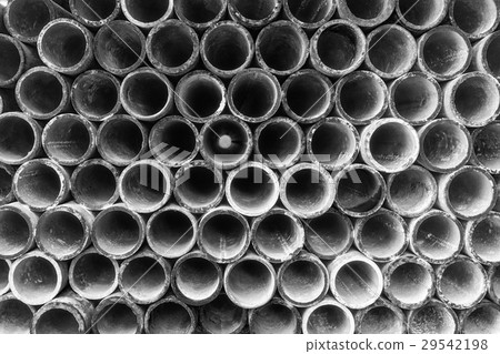 Abstract Steel pipes arranged on shelves Abstract Steel pipes arranged on shelves 29542198