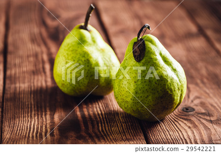 Two Pear on Wooden Background. 29542221