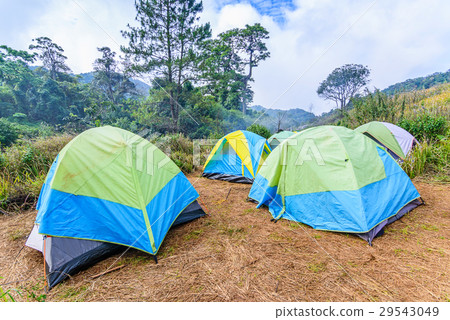 Mountain landscape with tourist tents on hill. 29543049