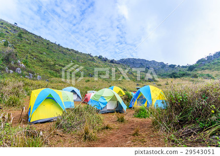 Mountain landscape with tourist tents on hill. 29543051