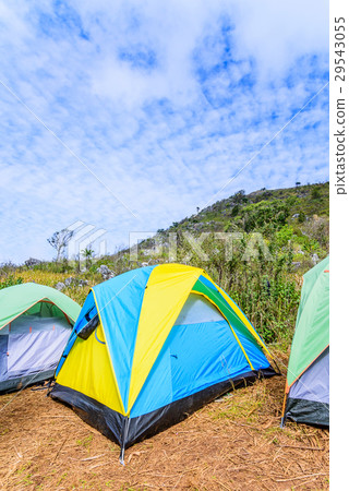 Mountain landscape with tourist tents on hill. 29543055