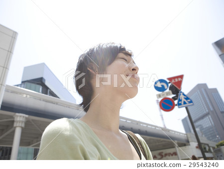 Young women in the street corners 29543240