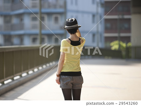 A young lady standing on the bridge 29543260