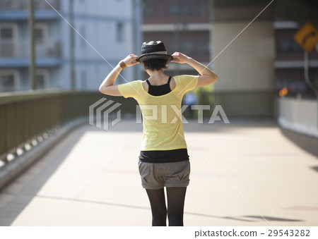 A young lady standing on the bridge 29543282